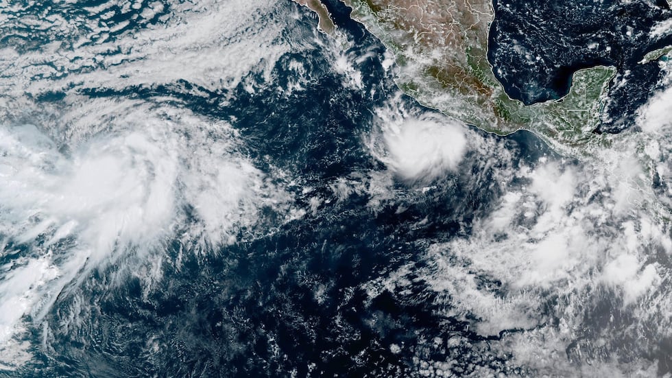 This photo provided by NOAA shows Hurricane Polo intensifying in the Pacific Ocean off the...