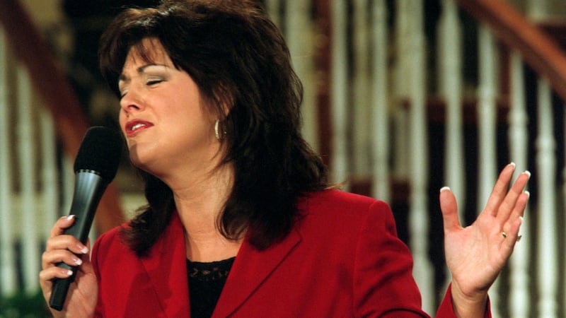 Television evangelistJoni Lamb sings a praise song during 'Celebration', a show that she and...