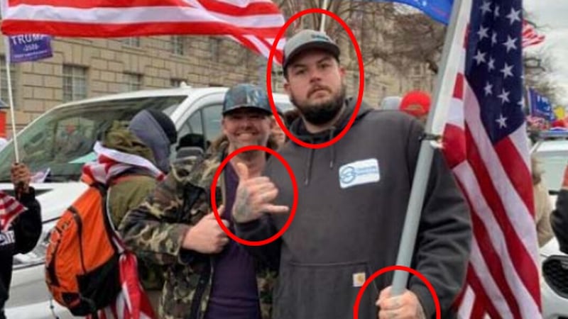 Cody Connell posing for a photo at the Capitol riots with his cousin, Daniel Adams