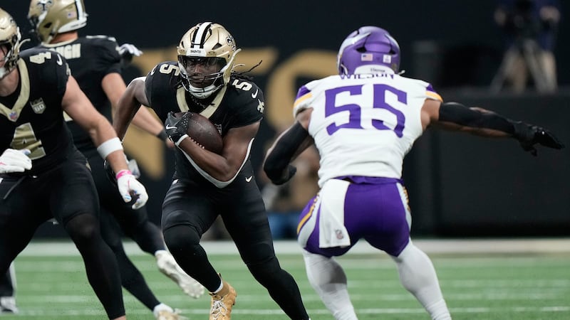 New Orleans Saints running back Kendre Miller (5) runs against Minnesota Vikings linebacker...