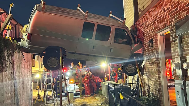 A person was injured after a van drove into a building, Cobb County fire officials said.