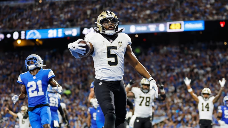 New Orleans Saints running back Kendre Miller (5) carries for a touchdown against the Detroit...