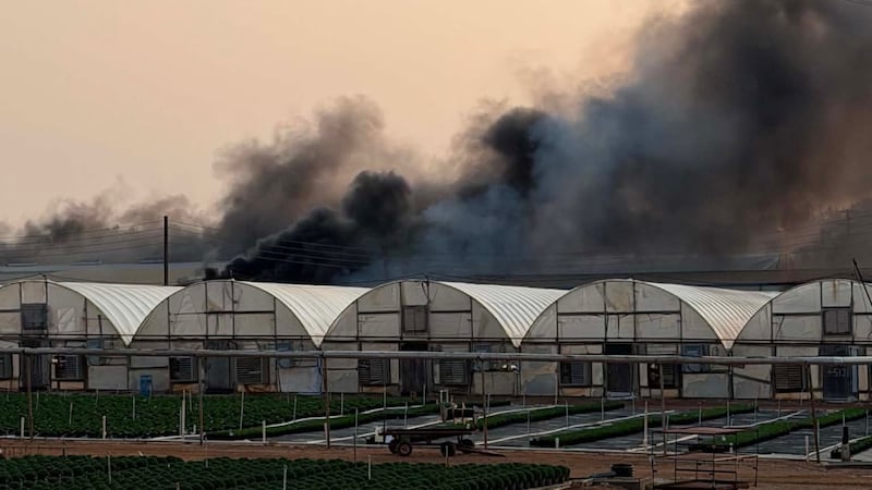 Smoke billows after flames engulf plant nursery building in Cherokee County