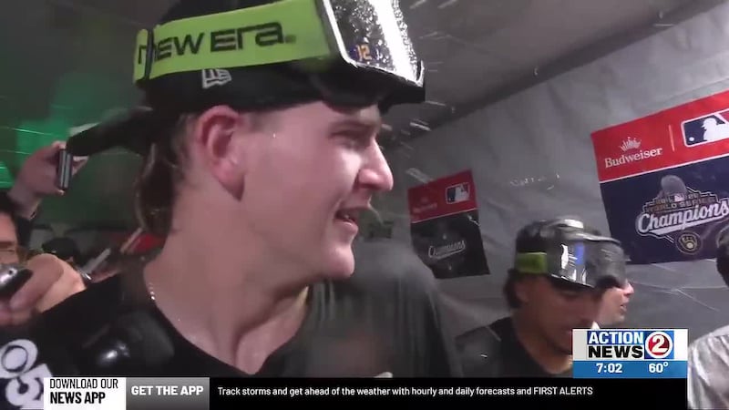 Milwaukee Brewers players celebrate their win with champagne showers